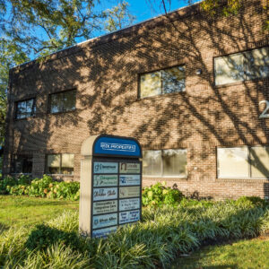 Image of building and pylon sign outside of the commercial office building located at 21 Old Main Street in Fishkill, NY.